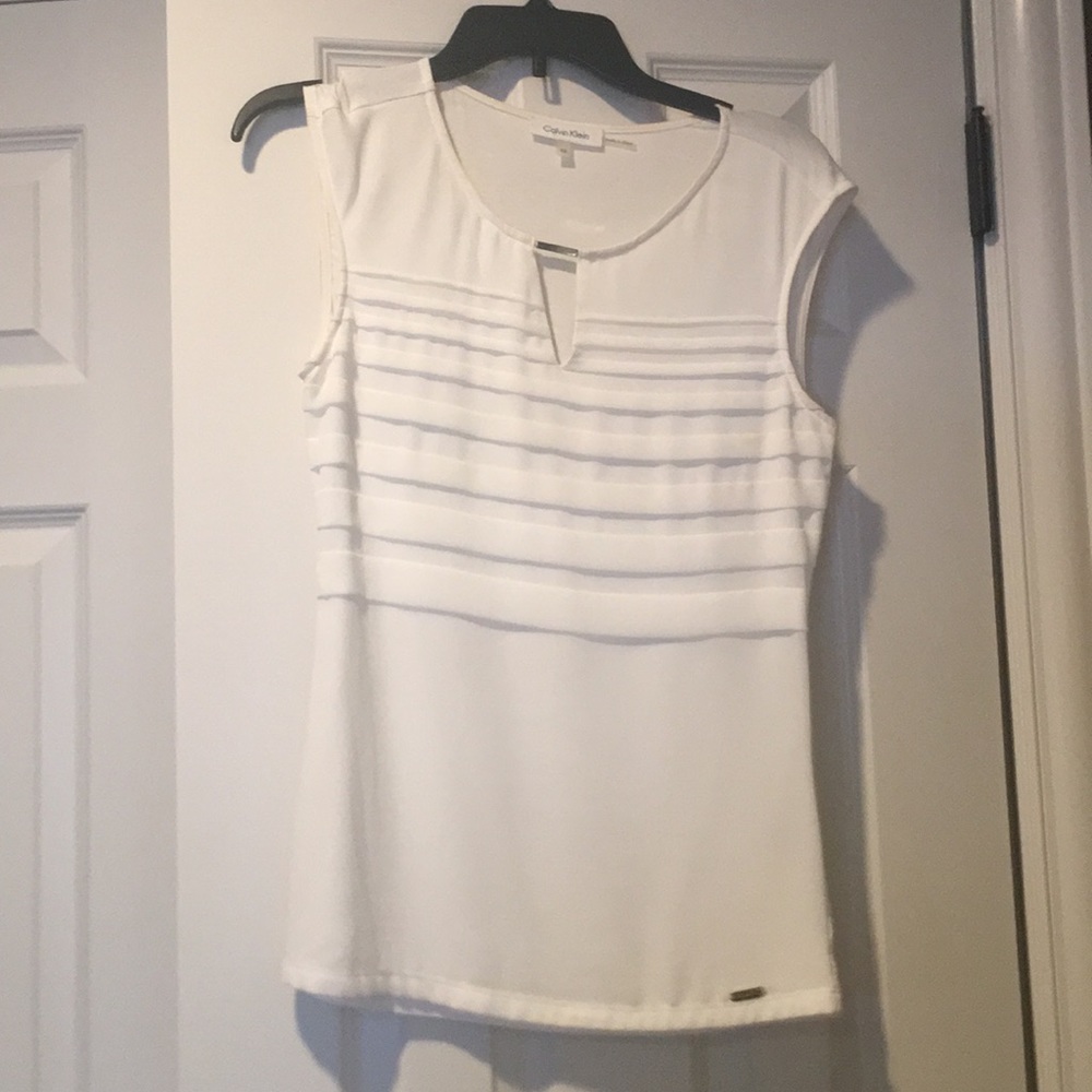 Cream sleeveless blouse